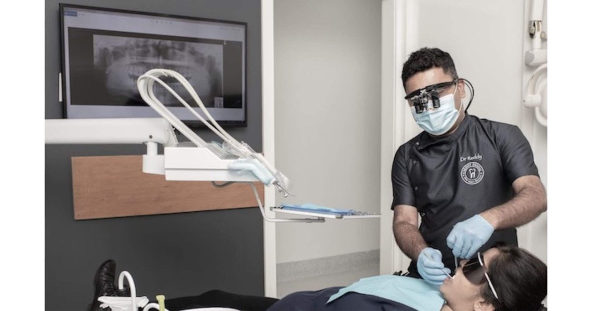 cardiff dentist examining a patient's gums during a check-up