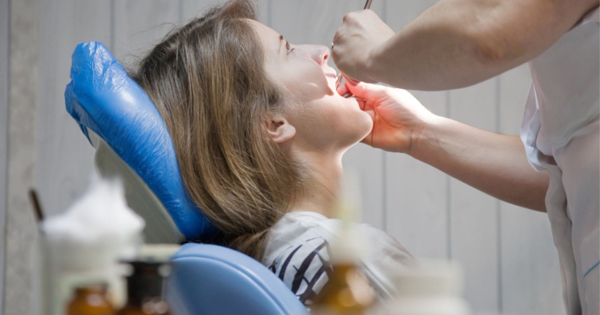 Dentist examining a patient's mouth during a check-up in Cardiff