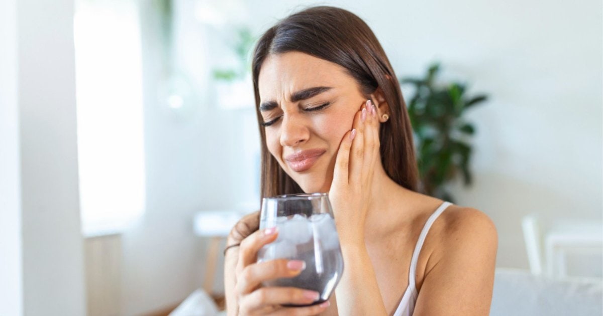 Person experiencing cold sensitivity in their teeth in Newcastle